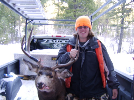 My son Kevin Jr. with a big buck from our land