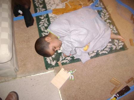 My son sleeping on the rug !