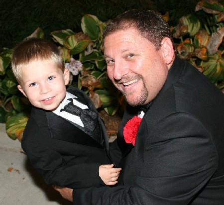 Me with Grandson at my daughter's wedding.