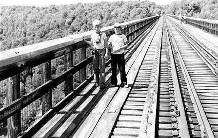 Clinger and Stewart on a bridge (circa 1975).