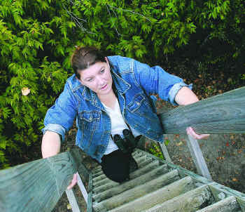 Climbing an observation tower at my research site.