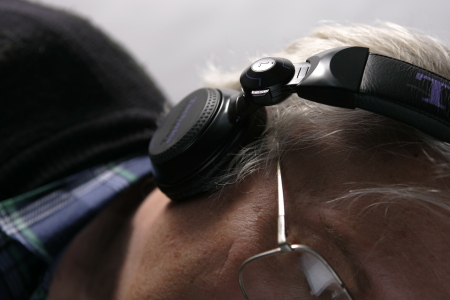 Ron Price, age 61, with his head phones on.