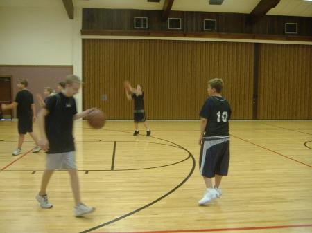 My son Joshua (in the background about to shoot), practicing for a basketball game Spring 2006