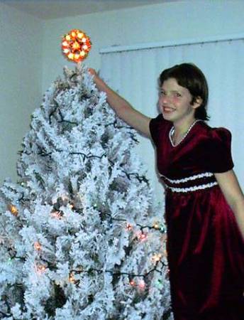 Elizabeth tops the Christmas tree