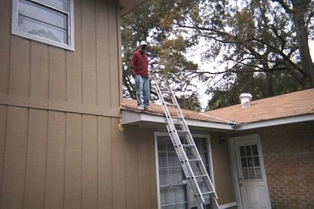 George checking the roof, 2003