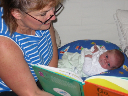 Grandma Holly reading Mia her first book at 4 days old!
