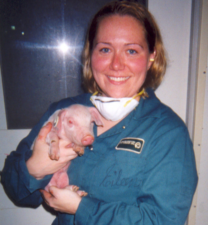 Myself and a 7 day old piglet.