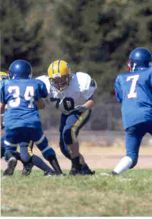 Christopher Playing Pop Warner Football in 2002