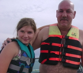 My husband and daughter in Torch Lake this summer