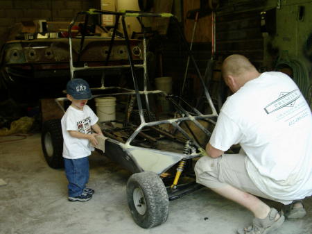 jimmy sand his new gocart to get it ready to paint