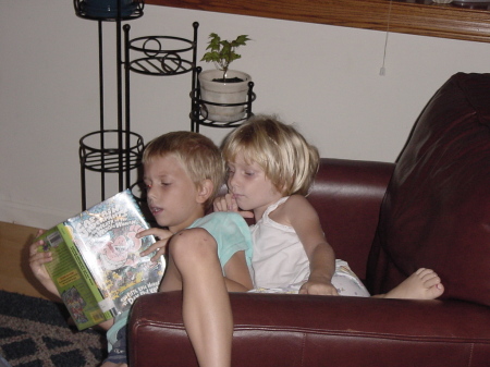 My Kids snuggling with a book