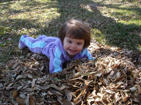 Emma in the leaves