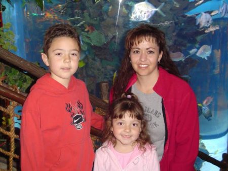 Me with my kids at the Rain Forest Cafe in Disneyland