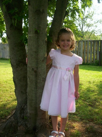 Olivia in the backyard the day of her pre-school graduation 2007