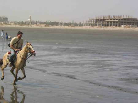 Horsing around on a beach in Karachi