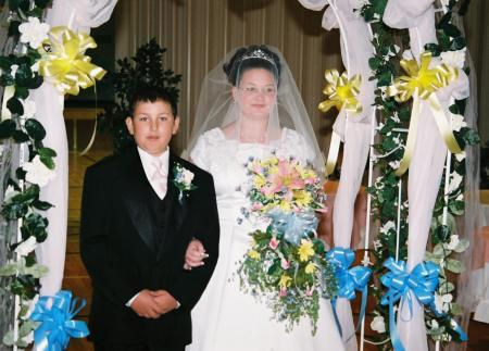 This is my son walking his sister down the ile for her wedding