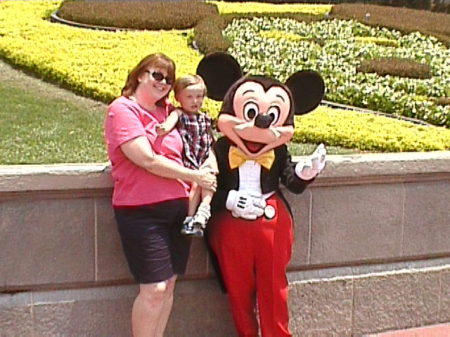 My wife and son with Mickey