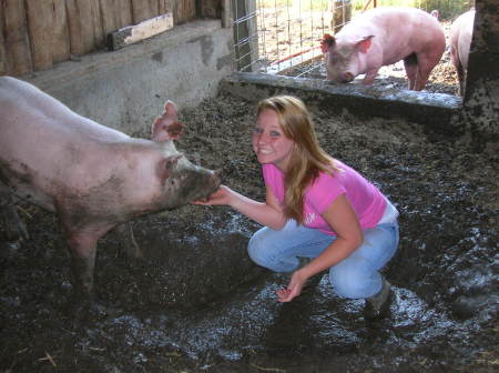 Haley & her 4-H pig....muddy & stinky but FUN!!