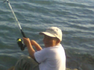 Matthew doing his favorite hobby, fishing.