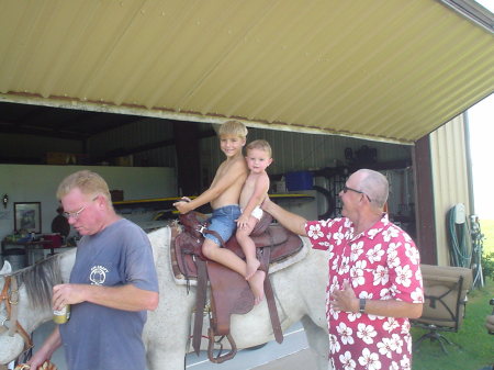 The Grandsons enjoying a horse ride at the hanger