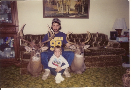 on the right jons first shotgun deer: on the left mark whites 1992 13 point, 28.5 in. non-typical aged 3.5