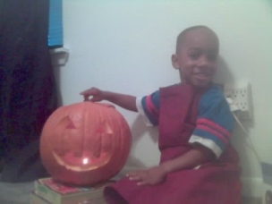 My nephew Cedric and the pumpkin he (helped) carved 2006