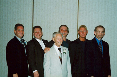 Joe and his brothers posing with dad in 2005