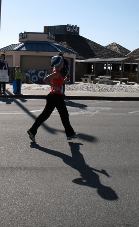 My wife Suzanne Bowen Running Pensacola Beach Half Marathon