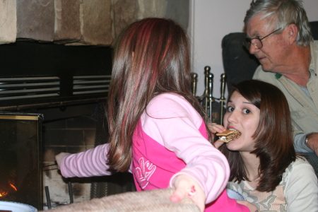 Em & Meg roasting marshmallows w/ PaPa Russ