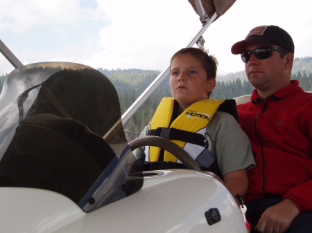 Driving the houseboat on the lake