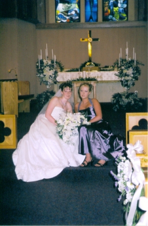 My sister, Sara (Skinner) Andoga, and me on her wedding day