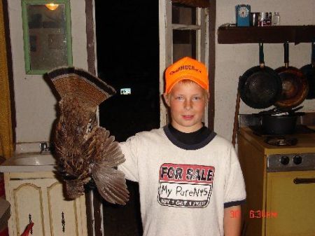 son and his first grouse!