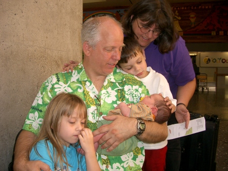 The Grandparents and Siblings with Newborn Son