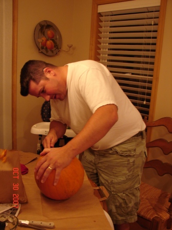 Dad cleaning out the pumpkin