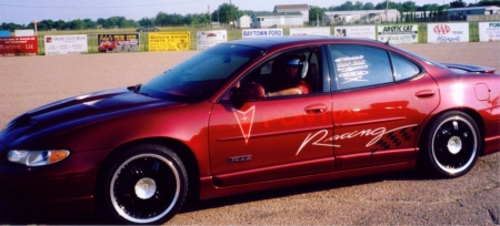 Me and my car at the Houston Speedway.. June 2006