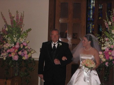 My daughter Ashley and I walking down the aisle at her wedding in Boston.