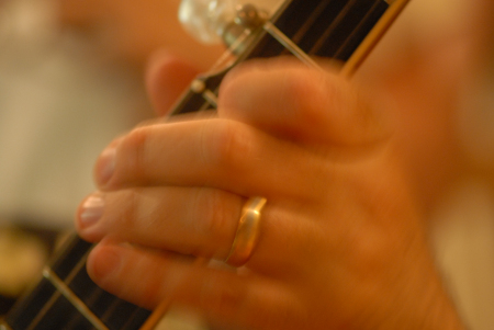 Lee riffs on the guitar