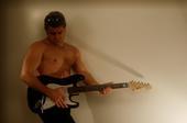 Me with the guitar.....and without my shirt...