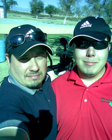 My son Denver and I on the golf Course