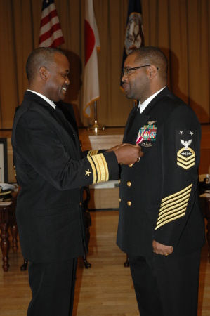 RADM A.J. Johnson pins Master Chief's Johnson END OF CAREER AWARD