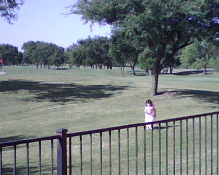My daughter on a golf course