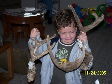 my nephew holding some deer horns ..he is so awesome .. gonna be the great white hunter in a few more yrs