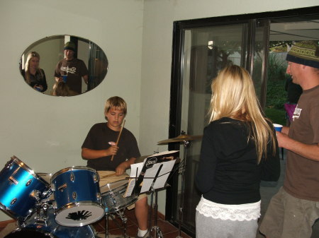 My son playing his drums