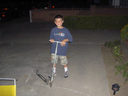 Skylar and his scooter in Cali