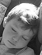 Elijah likes to sleep on road trips.