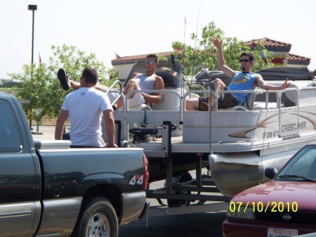 The young man in the middle on the boat is my oldest grandson.  His name is Troy.  On our way to Wiskey Town Lake last summber 2010 