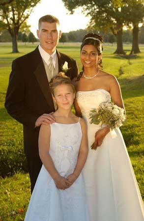My son, Jeff with his new bride, Sejal and my granddaughter, Lexie.