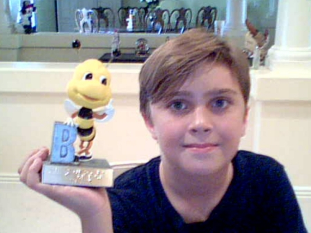 my little sweetie Ben showing off his trophy for winning the school spelling B