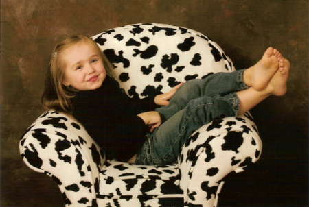 rylie on the cow chair
