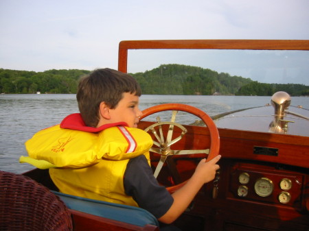 The kid at the helm on Muskoka.